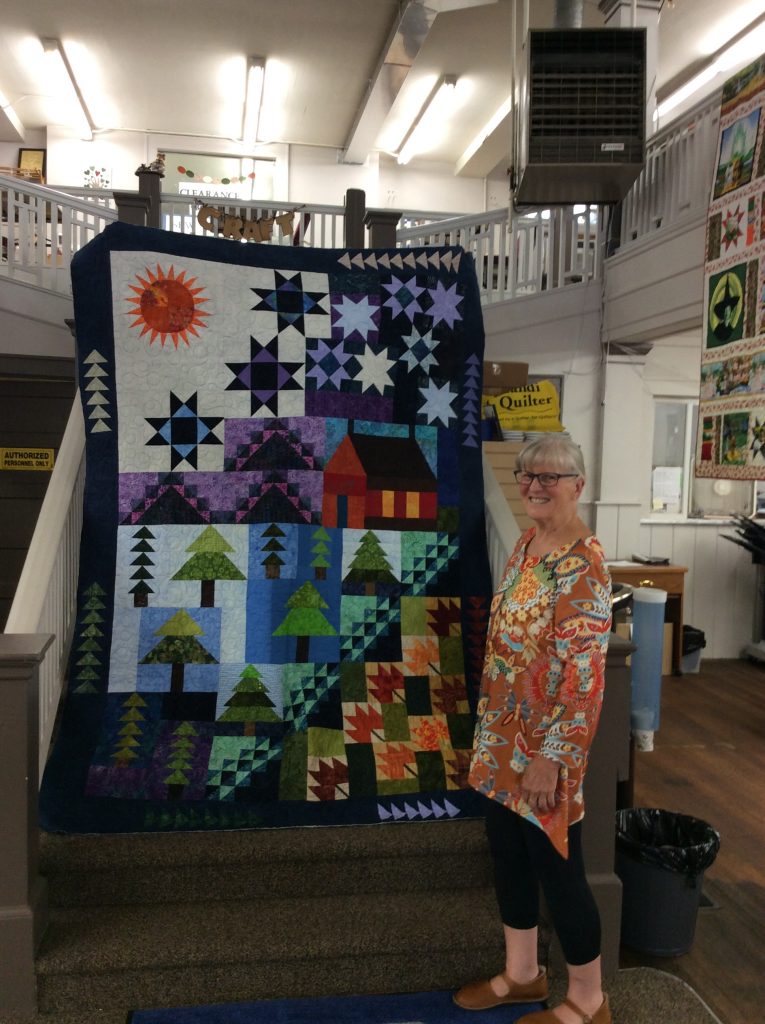 Christine finished the Cabin by the Lake block of the month.